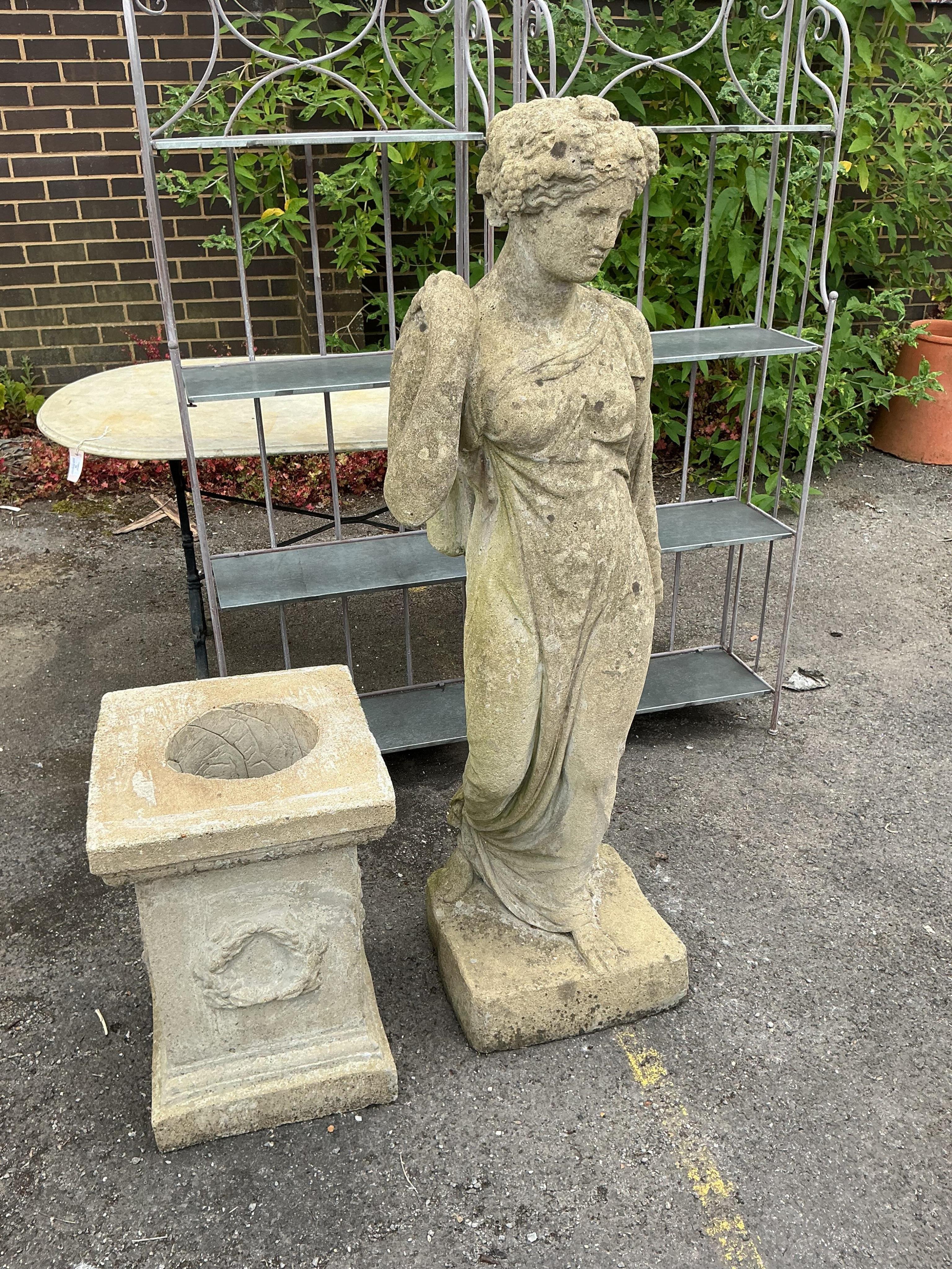 A large reconstituted stone garden statue of a standing classical female on square plinth, height 194cm